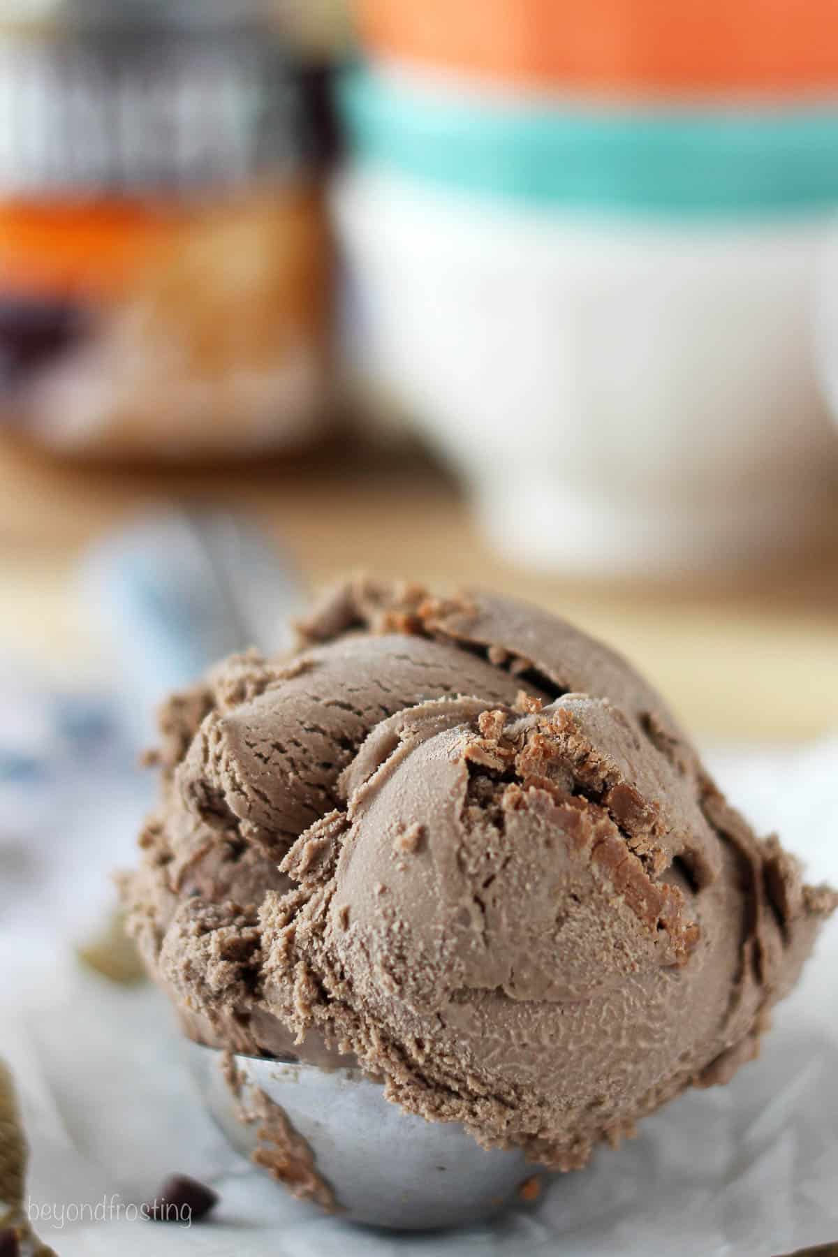 closeup of an ice cream scoop filled with homemade ice cream