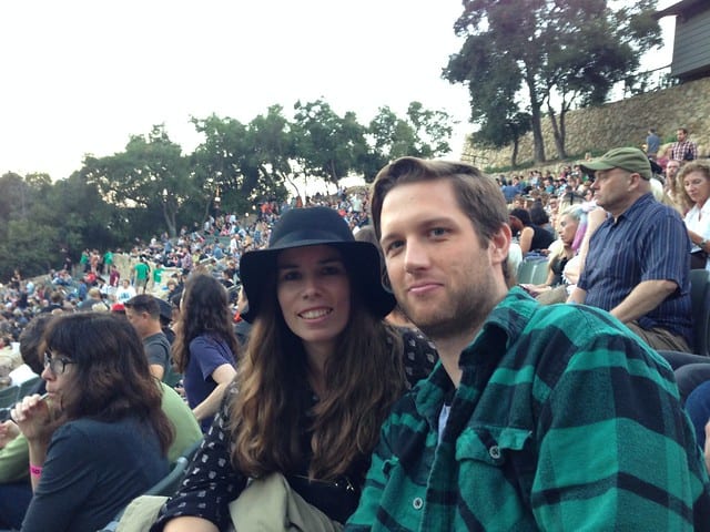 Blog author and husband sitting at an outdoor concert