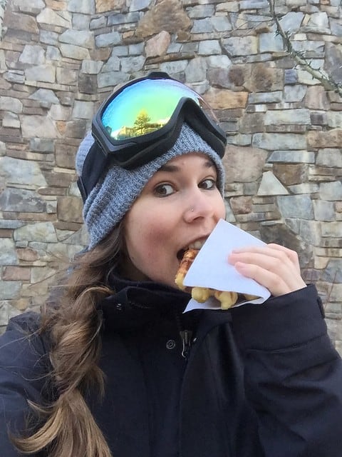 Blog author biting into a waffle