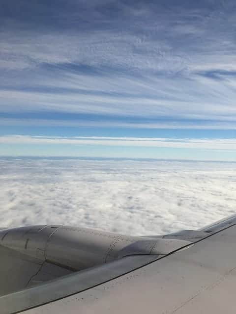View above the clouds from an airplane window
