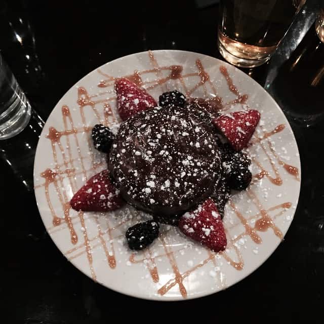 Overhead view of chocolate strawberry cake on a plate