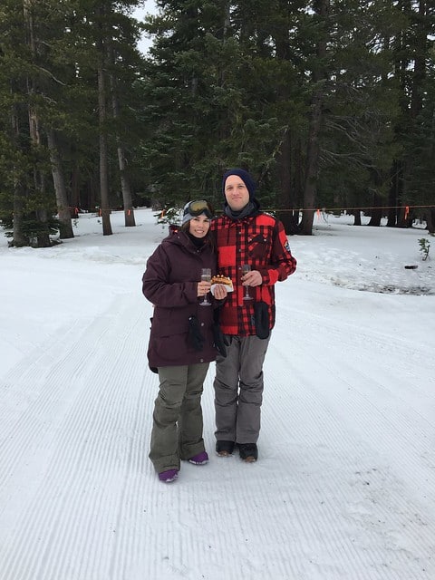 Blog author and her partner posing on a ski slope