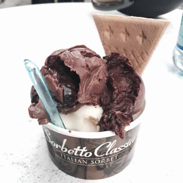 Chocolate and vanilla gelato in a paper cup