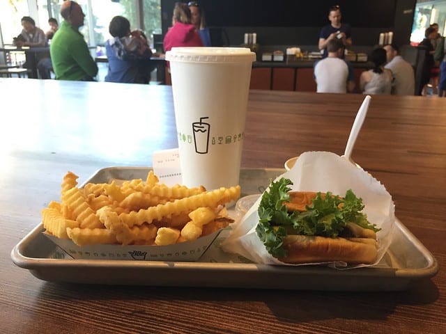 Side view of a burger, fries, and a shake from Shake Shack
