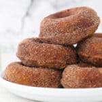 baked donuts piled on a plate