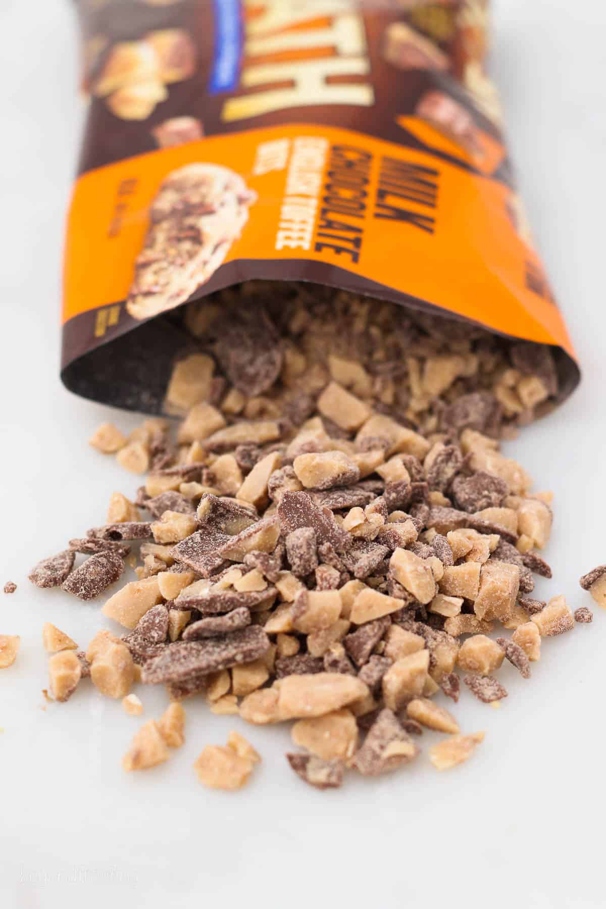 a bag of Heath Bar Milk Chocolate Toffee poured out on the counter