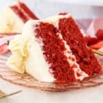 A slice of red velvet layer cake on a plate