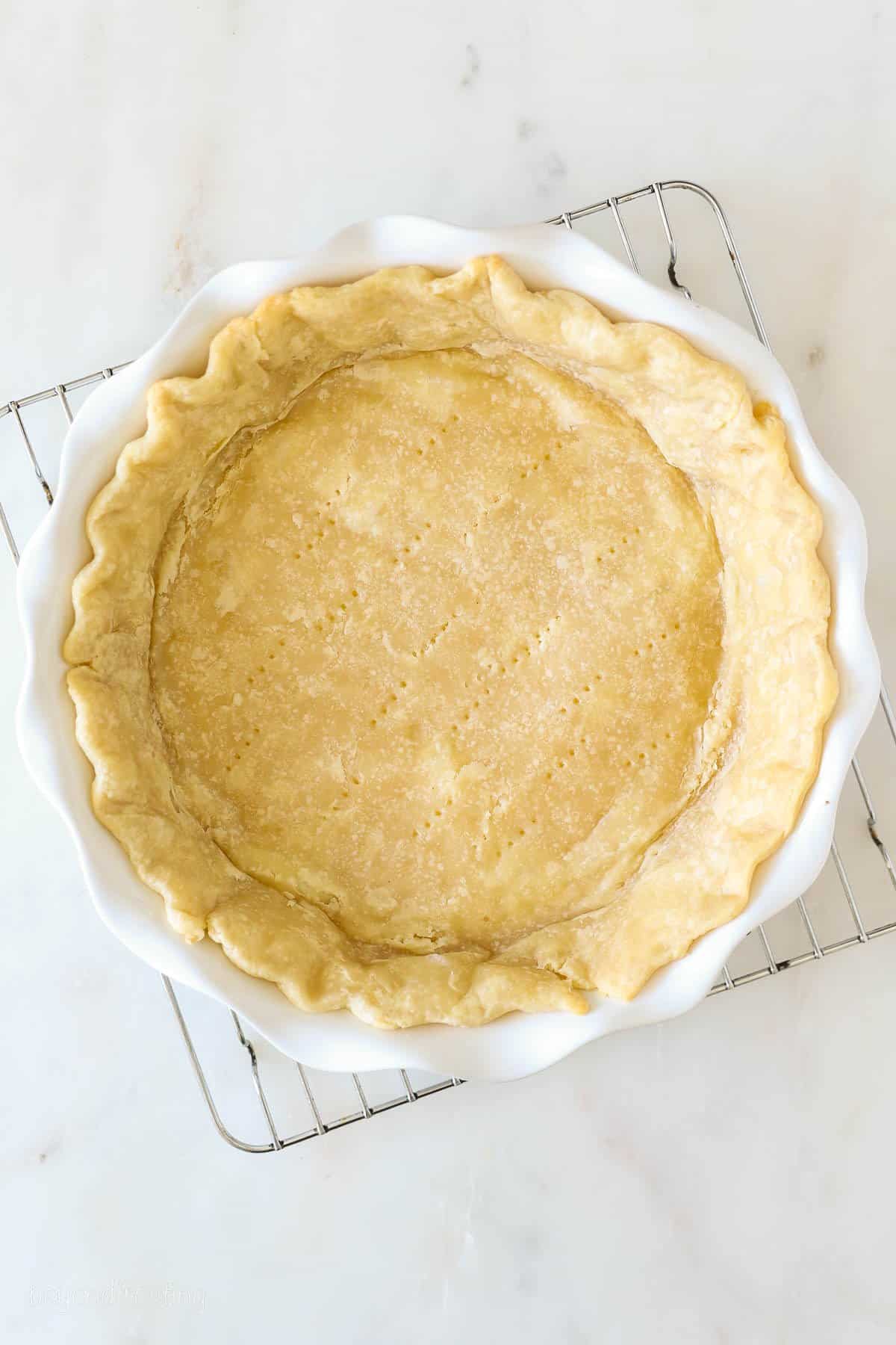 Overhead view of a partially baked pie crust