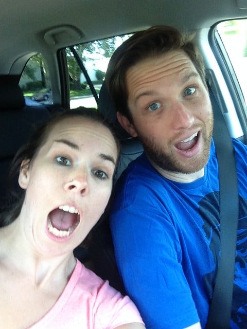 Author and her boyfriend in the front seat of a new car