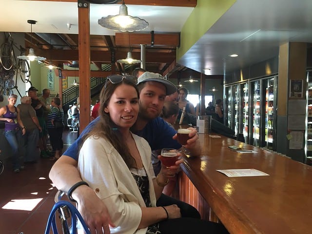 Author and her boyfriend sitting at a bar