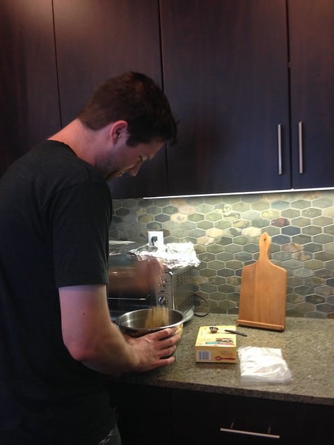 Author's boyfriend making snickerdoodles from a box mix