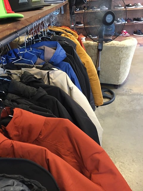 A rack of winter parkas at a store