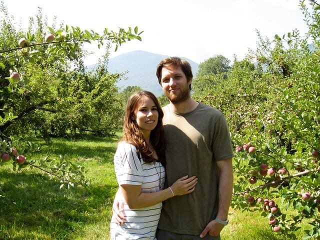 Author with her boyfriend in an apple orchard