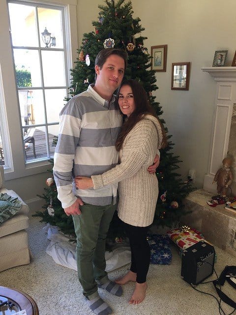 Author and her boyfriend in front of a Christmas tree