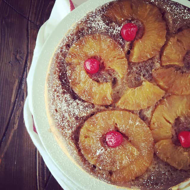 Overhead view of pineapple upside down cake on a plate