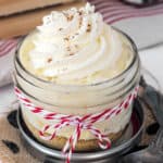 overhead of an eggnog pudding parfait topped with whipped cream