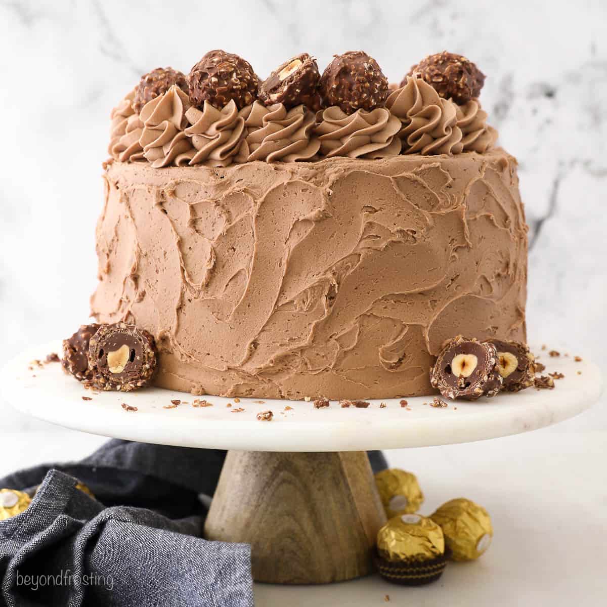 Ferrero Rocher Drip Cake with Gold leaves – Eclair Cake