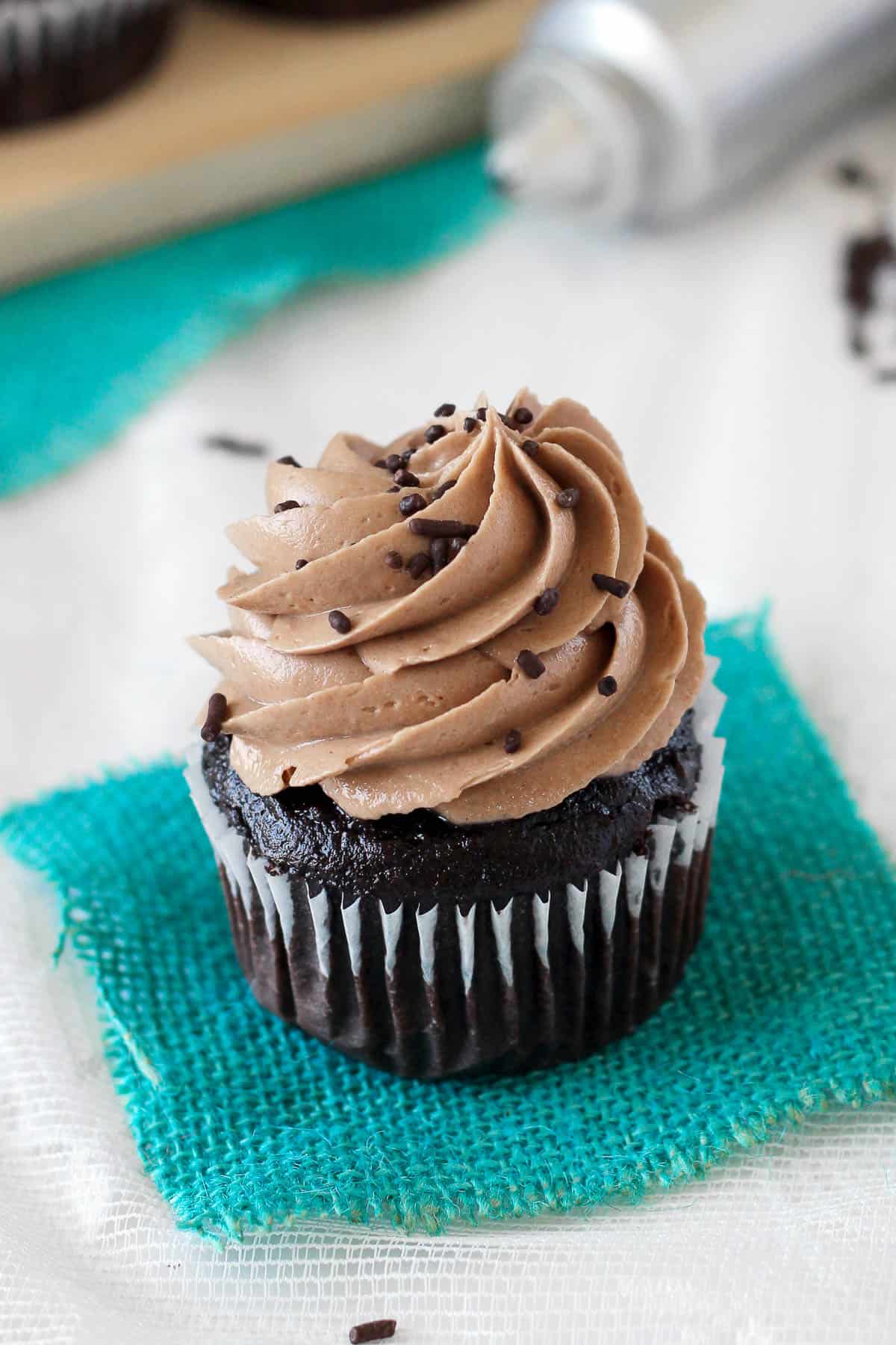 overhead of a chocolate cupcake topped with whipped chocolate peanut butter frosting