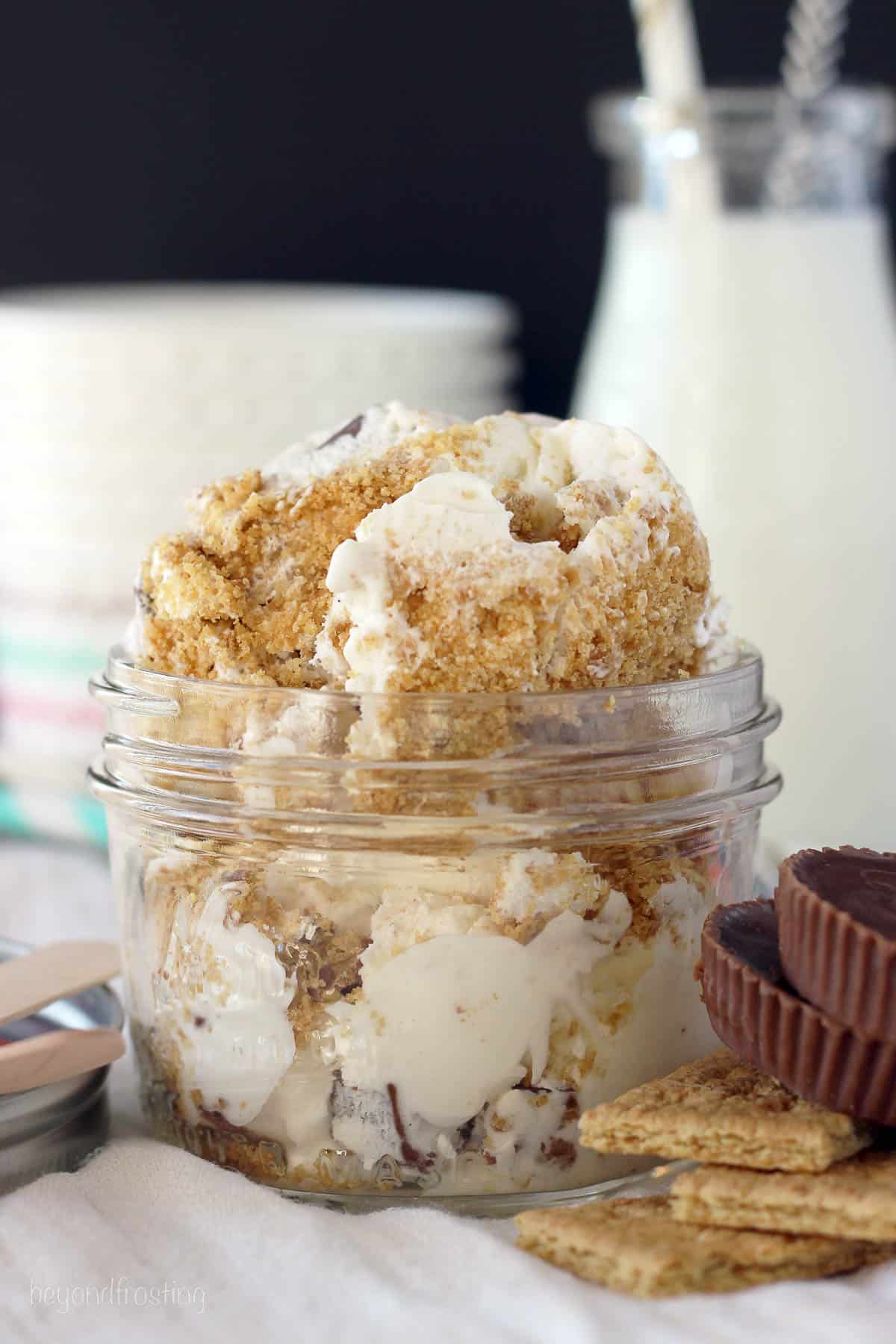 a small mason jar piled with s'mores peanut butter cup ice cream