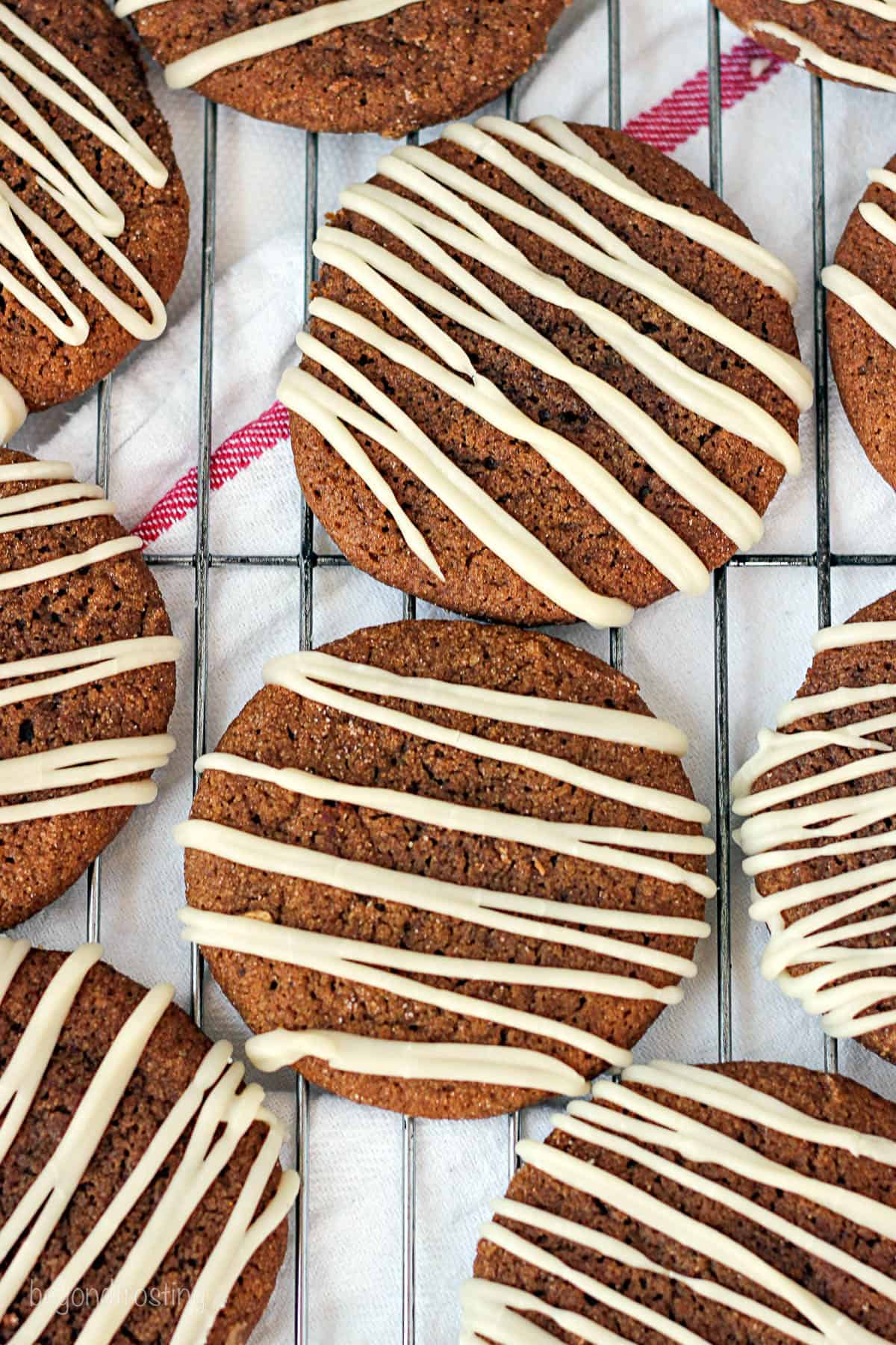 overhead of molasses cookies lined on a cooling rack