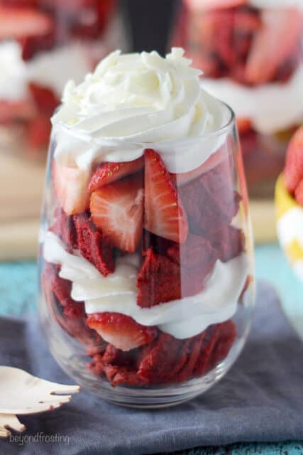 side view of a waffle parfait with strawberries and whip