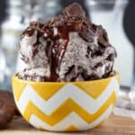 side view of a yellow and white bowl filled with thin mint ice cream