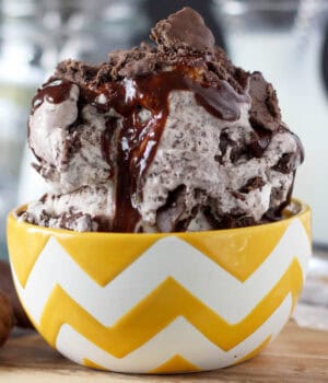 side view of a yellow and white bowl filled with thin mint ice cream