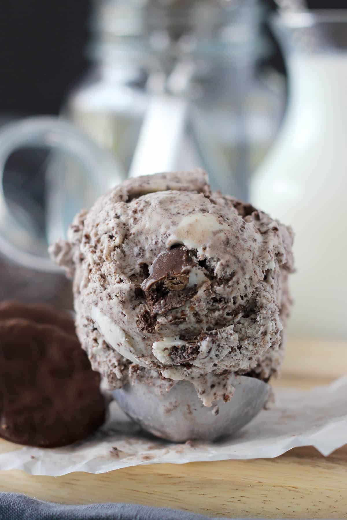 an ice cream scoop piled with a scoop of thin mint ice cream