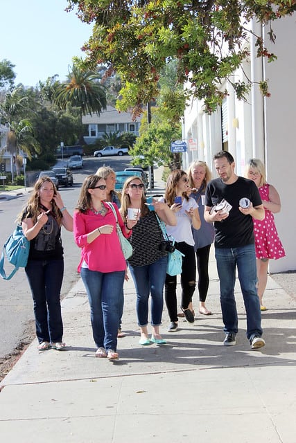 A group of food bloggers walking on the street in Santa Barbara