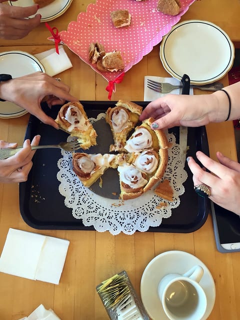 Overhead view of wedges of pastry being cut