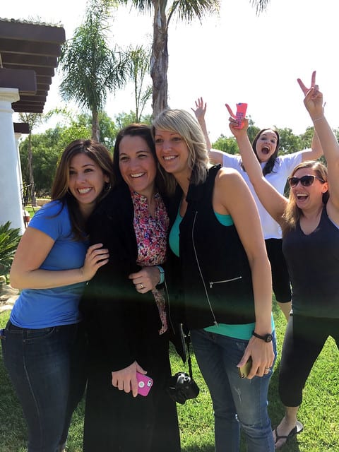 Three bloggers posing together at a party