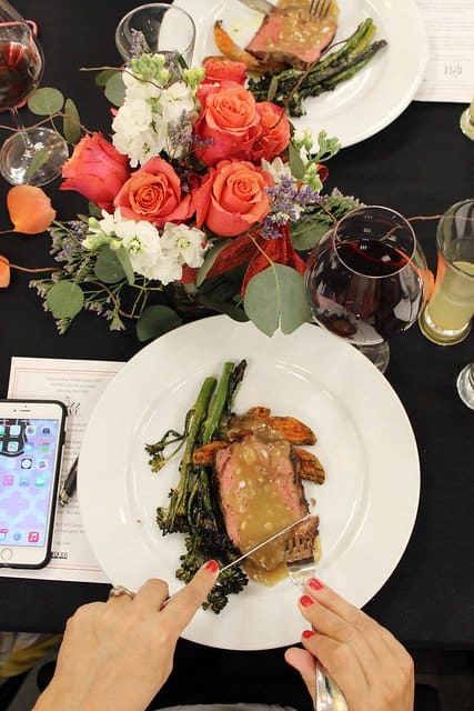 Overhead view of a plate of fish with broccolini