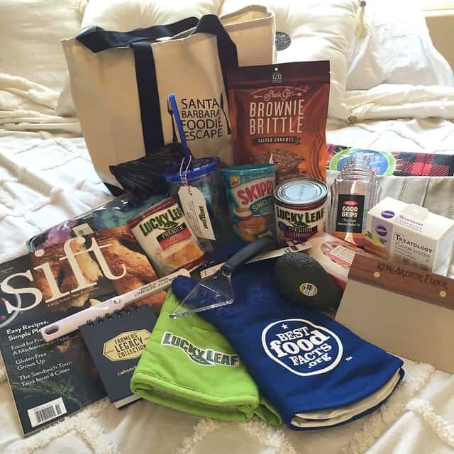 Santa Barbara Foodie Escape tote bag with gift bag contents spread in front