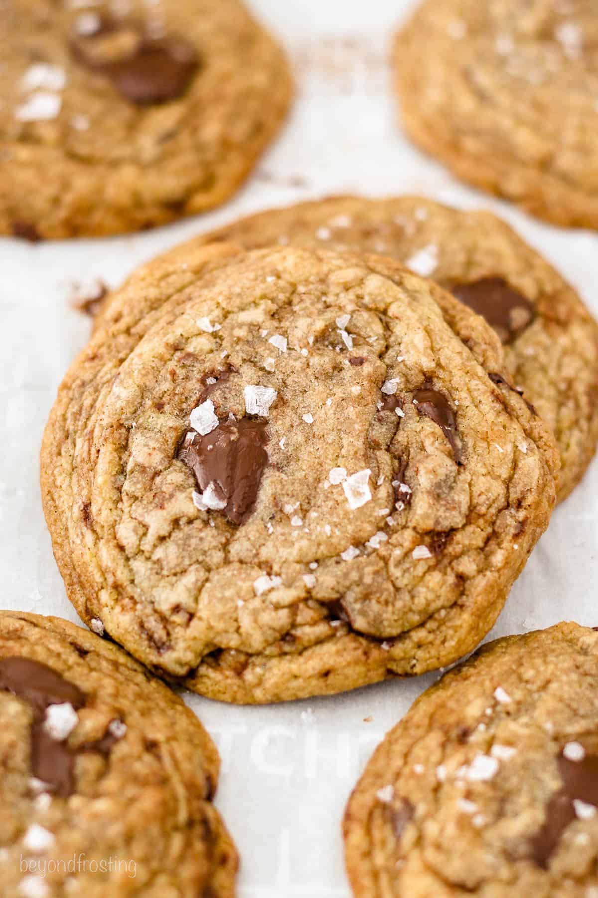 overhead of brown butter cookies on a piece of parchment paper