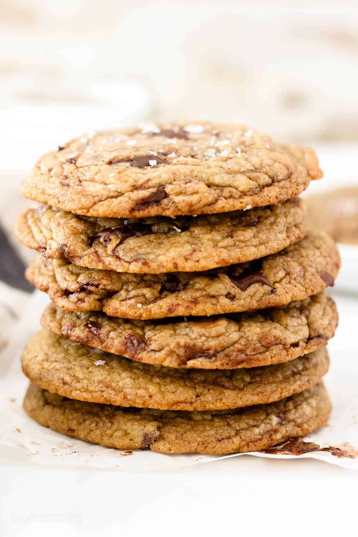 six brown butter chocolate chip cookies stacked