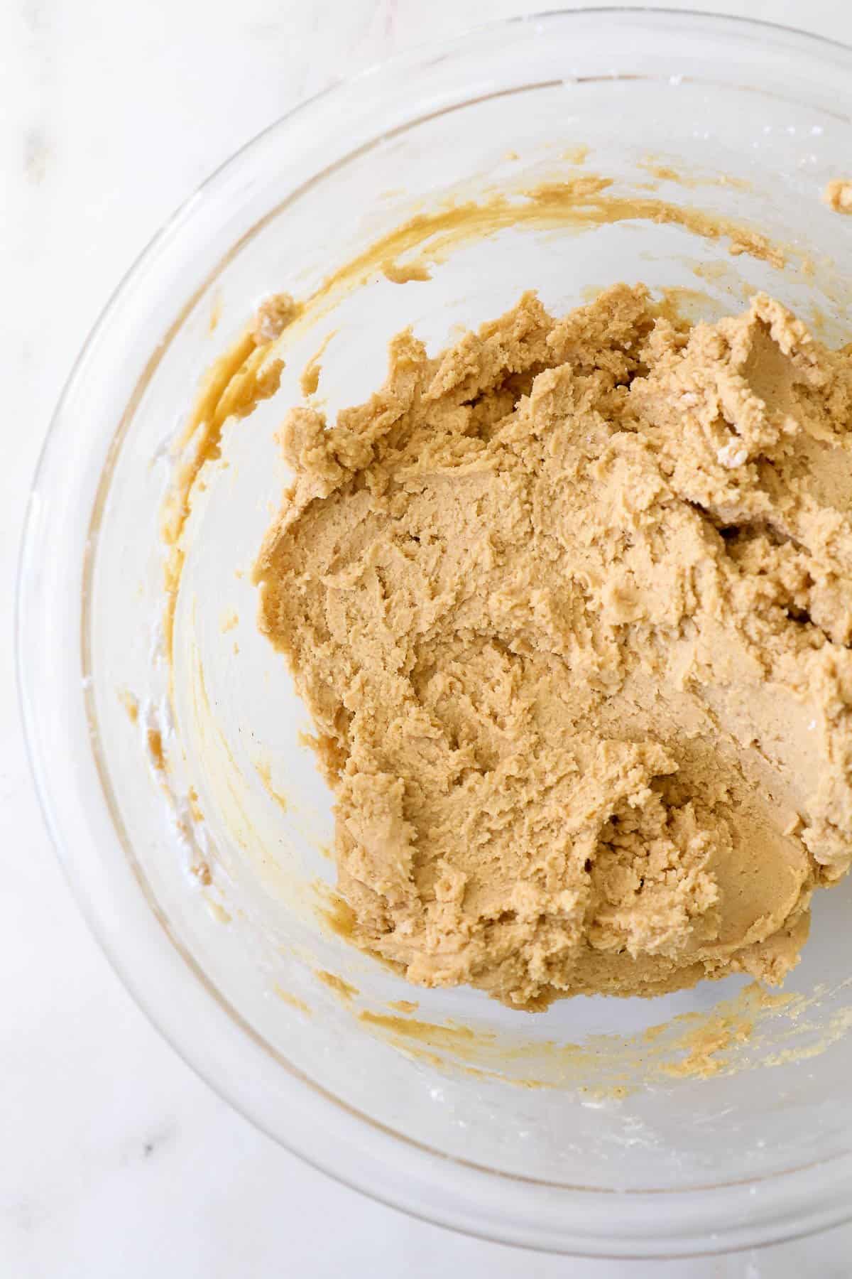 Peanut butter fudge mixture in a glass bowl.