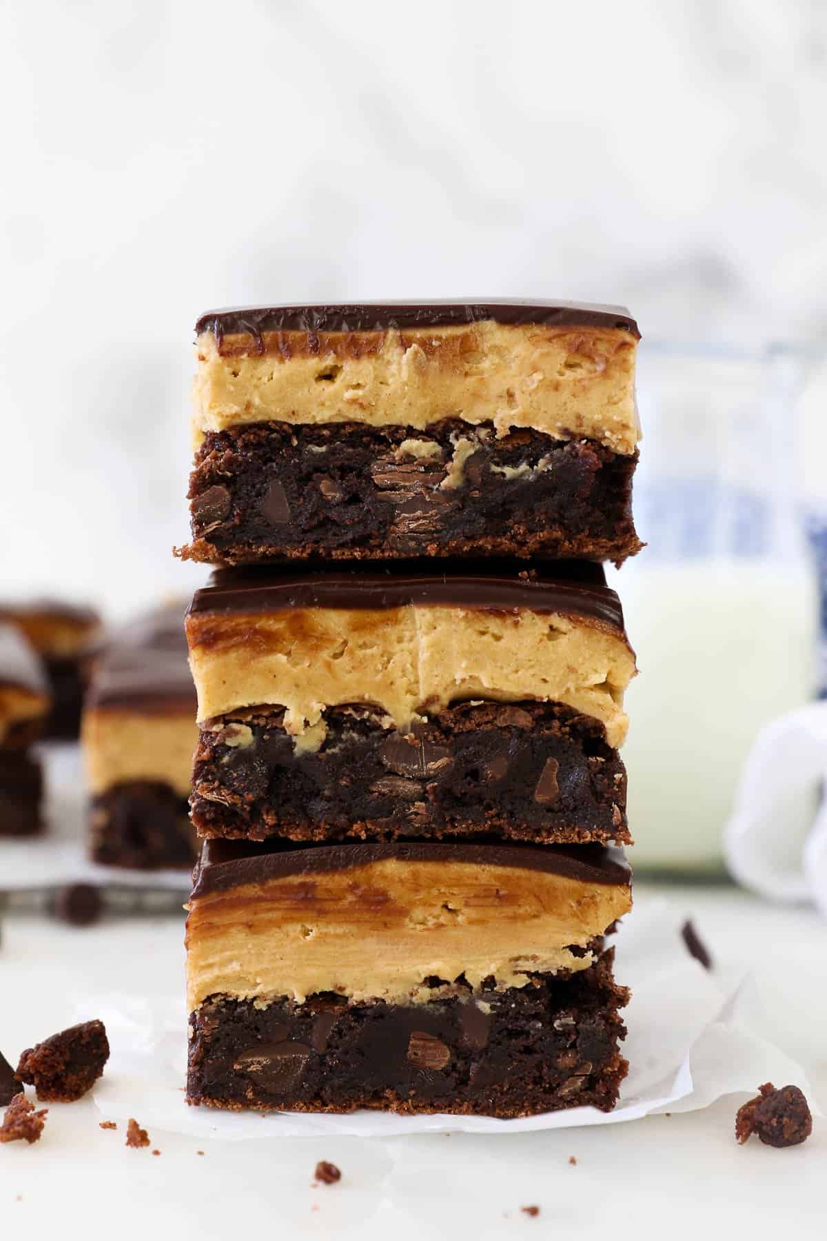 Three buckeye brownies stacked on top of each other.