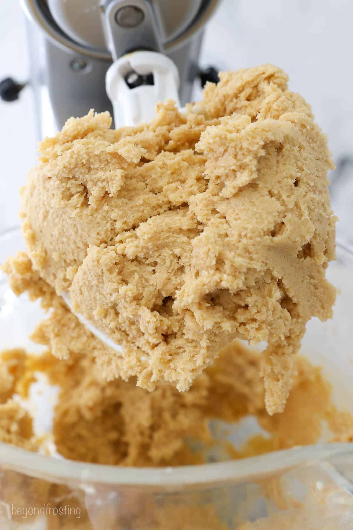 A stand mixer attachment with cookie dough