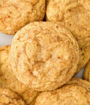 A top down view of pumpkin snickerdoodles laid on top of one another