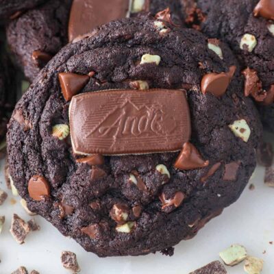Overhead view of an Andes Mint cookie topped with an Andes Mint, with more cookies in the background.