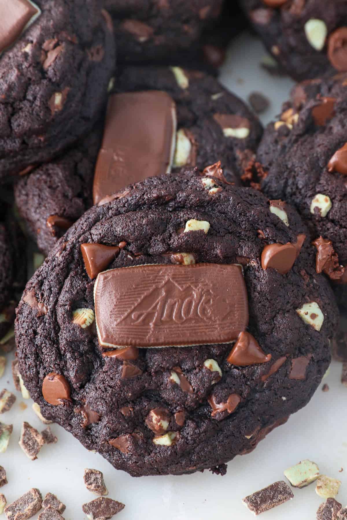 Overhead view of an Andes Mint cookie topped with an Andes Mint, with more cookies in the background.