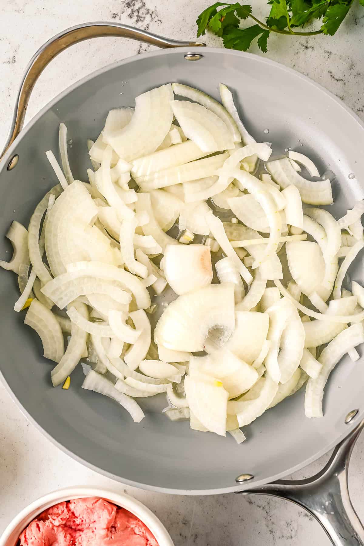 Chopped onions in a skillet.