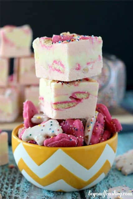A stack of Circus Animal Fudge in a bowl of Circus Animal Cookies