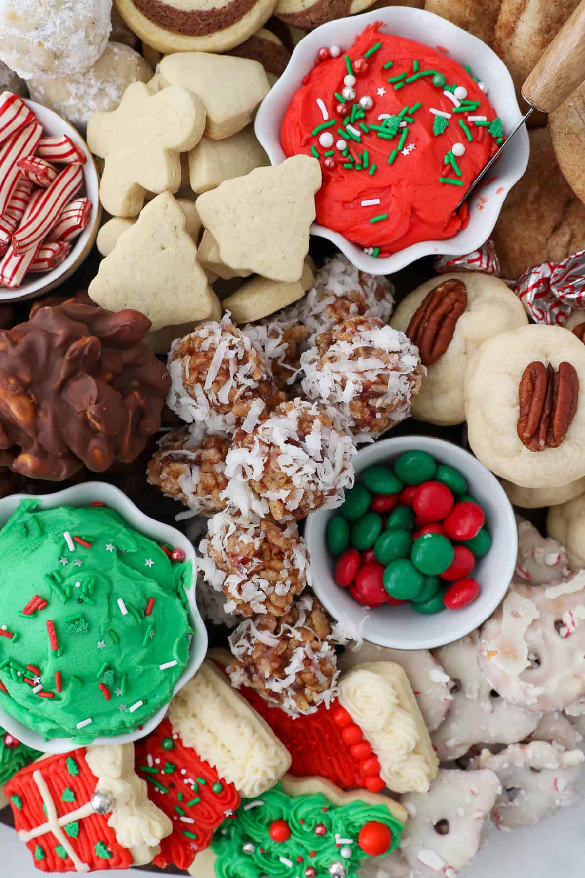 close up shot of a Christmas cookie board with candy and cookies