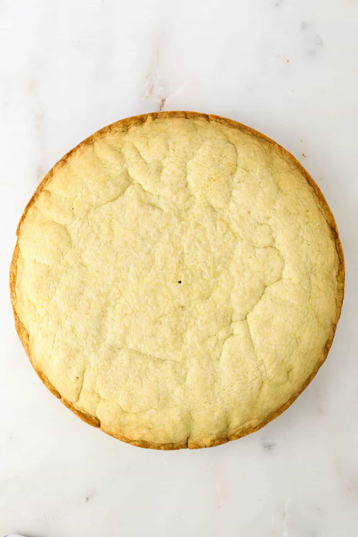 baked sugar cookie cake on a marble background