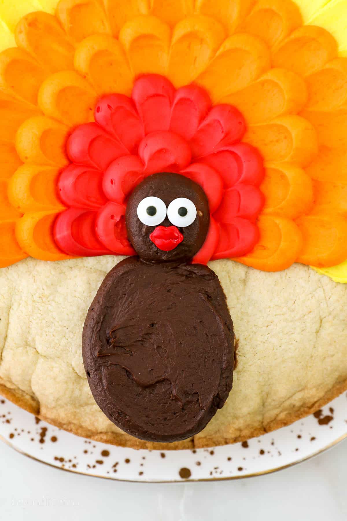 Close up of a butttercream turkey piped on a cookie