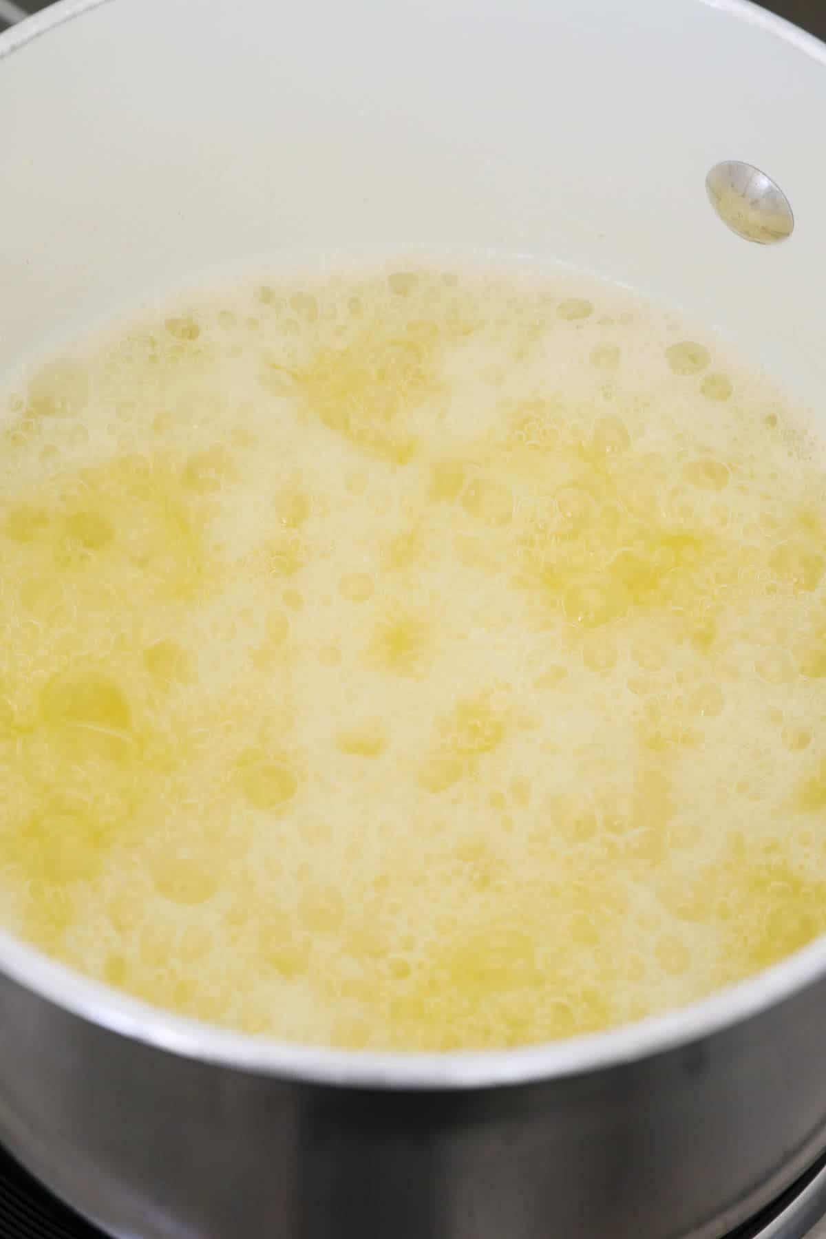 a put of boiling sugar and butter for a rum glaze