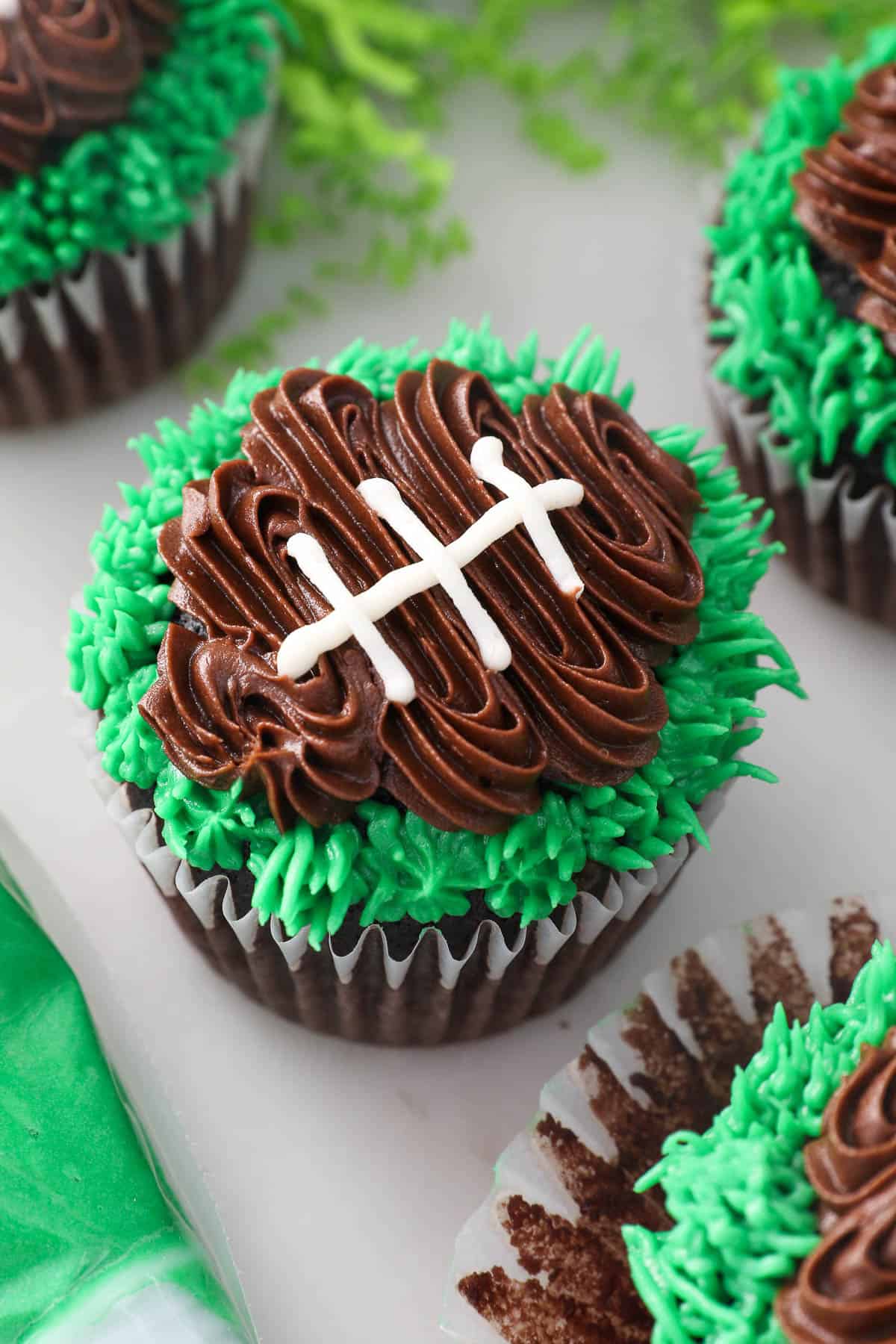 Close up of a frosted football cupcake.