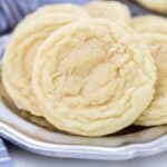 Homemade sugar cookies arranged on a plate.