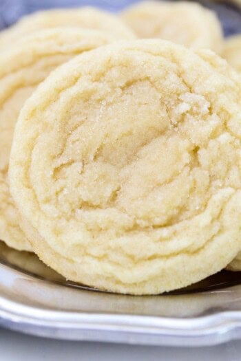 Homemade sugar cookies arranged on a plate.